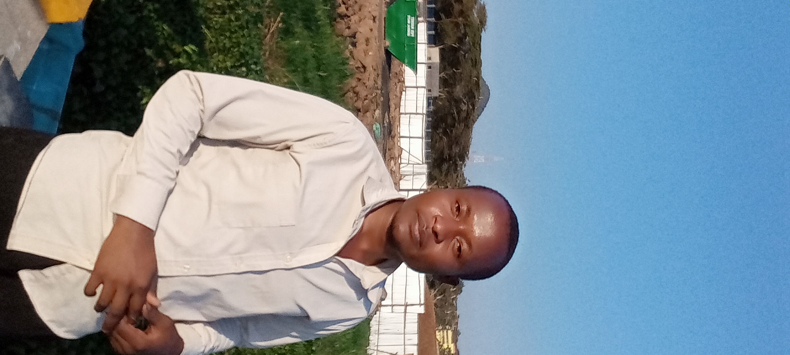 Bill Clinton Ooko surveying agricultural land in Kabondo