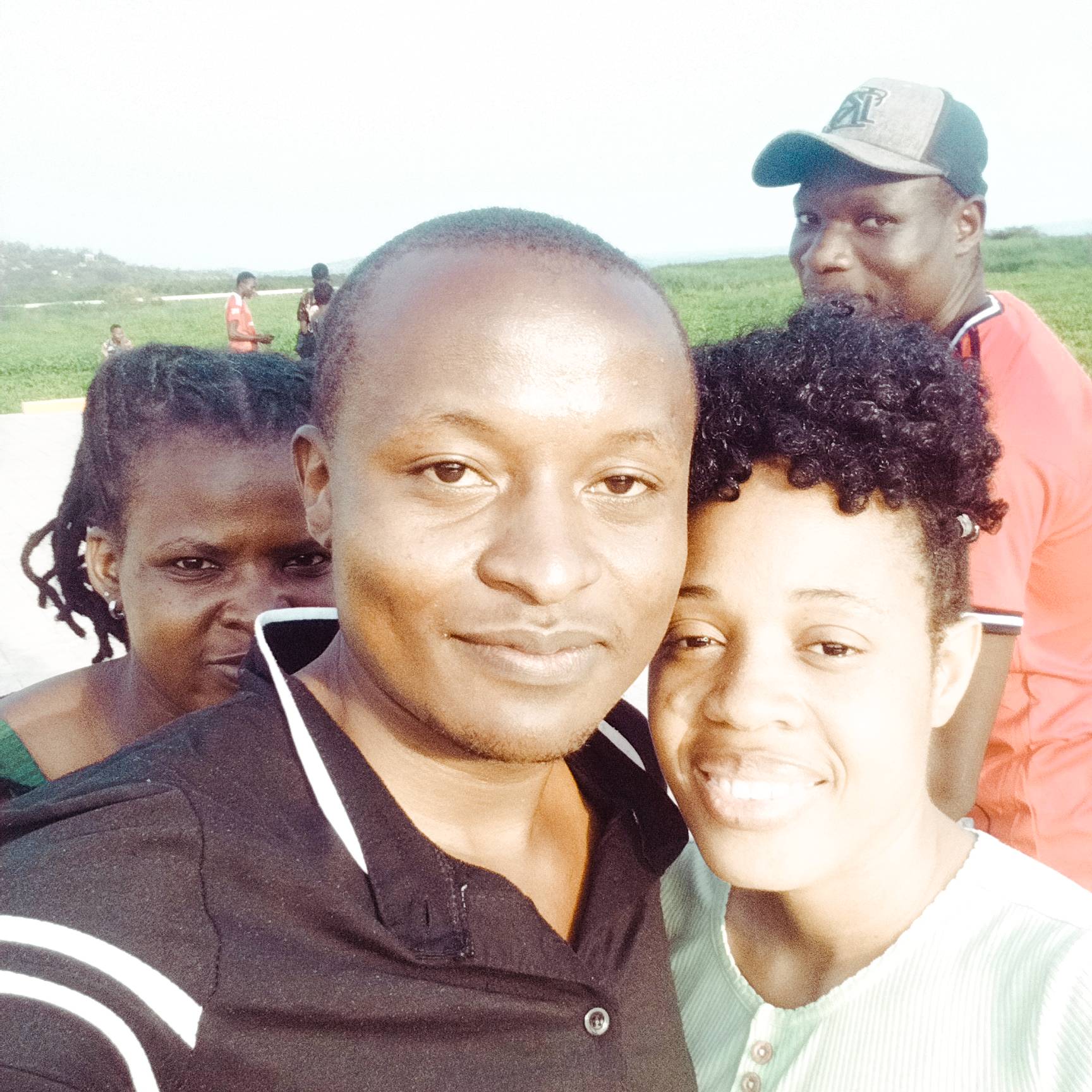Bill Clinton Ooko with community members in rural Kenya